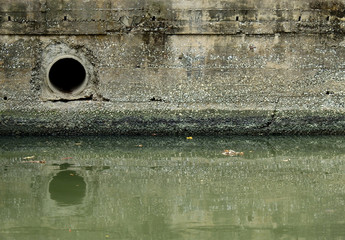 Drainage on old wall in canal