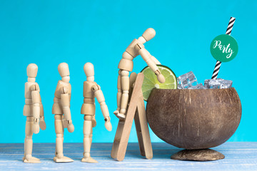 Wooden puppets in the queue for fresh iced summer cocktail. Party time