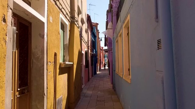Tracking shot through colorful street in Burano, near Venice, Italy