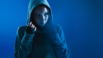 Fototapeta na wymiar Fitness woman in hooded shirt
