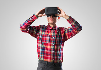 Guy in mask experiencing virtual reality as new entertainment device