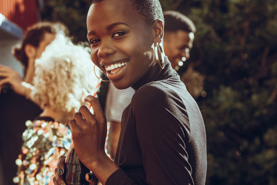 Cheerful Woman Hanging Out With Friends