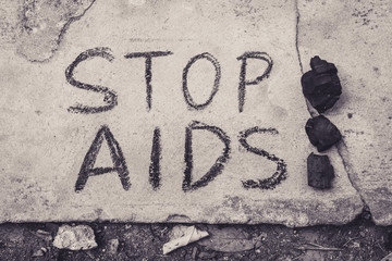 Stop Aids text hand write by black chacoal.