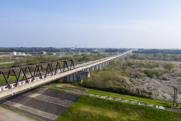 Fototapeta na wymiar 利根川の鉄橋を通過するつくばエクスプレスを俯瞰撮影