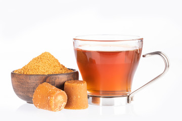Fresh homemade Aguapanela, Agua de Panela or Aguadulce, a popular Latin American sweet drink made of panela unrefined whole cane sugar boiled in water, served warm or cold with lime.