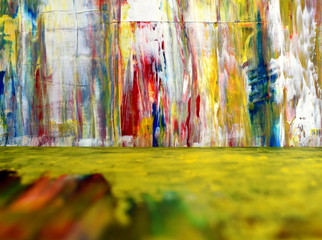 Colorful paint splashes. Disordered pigment spots. The foreground is unclear. Bright colorful background.
