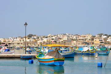 Fototapeta na wymiar Marsaxlokk, Malta. A beautiful, small, traditional fishing village in the South Eastern Region of Malta