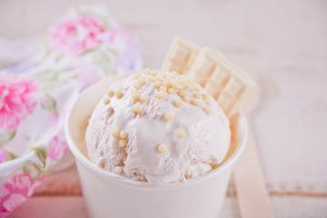 Obraz na płótnie Canvas Vanilla ice cream with white chocolate on the white background.