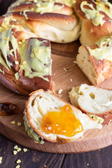 Swirl brioche with citrus glaze. Braided or roll bread, Babka. 