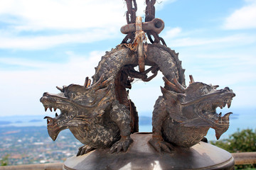 dragons on the bell near the big Buddha statue, Thailand