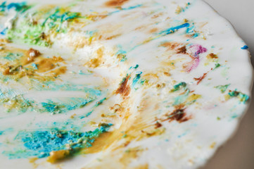 White plate with cake residues isolated on a white background