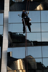 Workers cleaning a facade at height