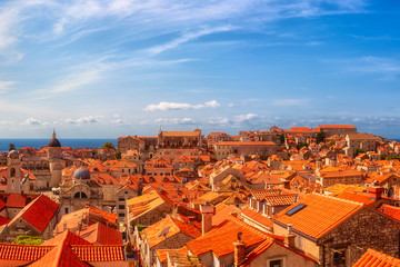 Fototapeta premium Dubrovnik Old City red tiled roofs, panoramic view from the ancient city wall, scenic cityscape. World famous and most visited historic city of Croatia, UNESCO World Heritage site, travel background