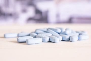 Lot of whole blue medical drug stack on the table in a hospital