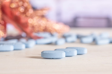 Group of three whole blue medical drug on the table in a hospital