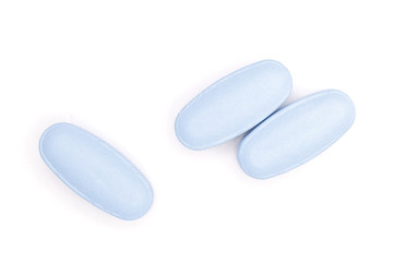 Group of three whole blue medical drug flatlay isolated on white background
