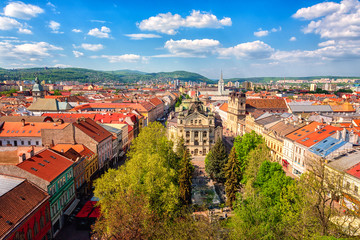 Fototapeta na wymiar Top view of Main street (Hlavna ulica) of Kosice Old city from St. Elisabeth Cathedral, with State theatre Košice (Statne divadlo) and medieval architecture, Slovakia (Slovensko)
