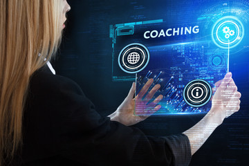 The concept of business, technology, the Internet and the network. A young entrepreneur working on a virtual screen of the future and sees the inscription: Coaching