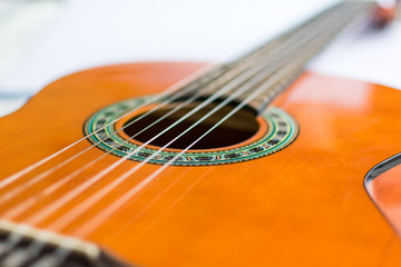 Classic acoustic guitar on white background view.