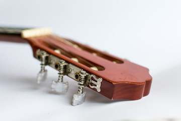 Classic acoustic guitar on white background view.