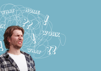 Young caucasian man with mixed thoughts against blue background. Negative space to insert your text. Concept of thinking confusion, stress out, misunderstanding, facial expression, human emotions.