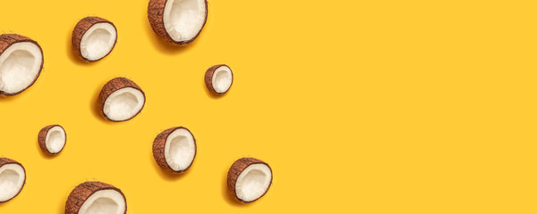 Tropical abstract coconut pattern on yellow background. Flat lay.