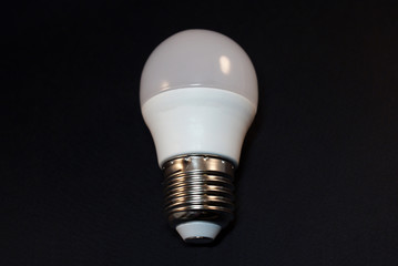 Electric incandescent lamp on a black background.