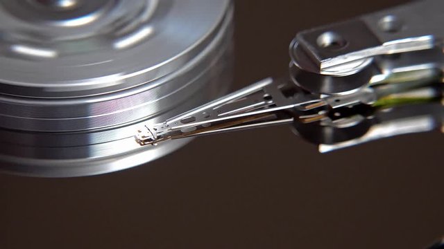 Close-up of an operating computer harddisk reading and writing data