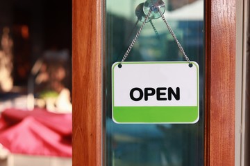 open sign hanging at door for entrance