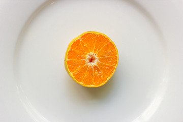 Top view of fresh sliced  oranges on the plate