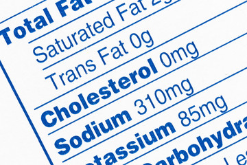 Macro close up detail of standard food nutrition facts information box.  With focus on Trans Fat,...