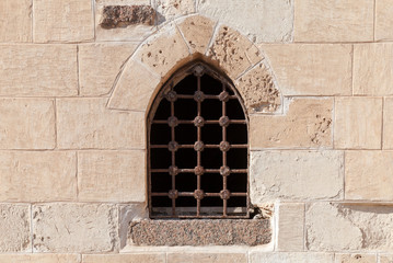 Fototapeta na wymiar Old fortress stone wall with window