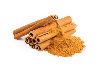 Cinnamon sticks and powder on white background