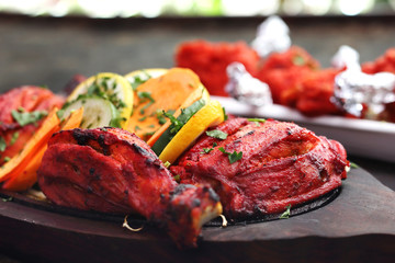 Oriental eastern cuisine. Tandoori chicken in a spicy marinade. 