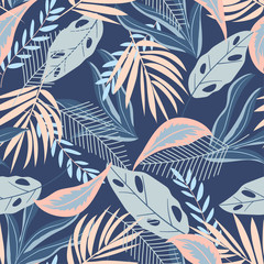 Seamless pattern with pastel tropical leaves on blue background. Vector design. Flat jungle print. Floral background.