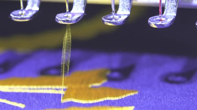 Close-up needle of Computerized machine embroidery , Industrial Sewing , embroidery machine close up shot