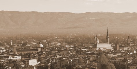 Fototapeta na wymiar Panoramic view of Vicenza city with old toned sepia effect