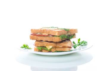 fresh sandwich with vegetables, bacon and cheese on a white