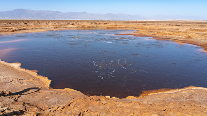 Acid bubbling pond in the Danakil depression in Ethiopia in Africa.	