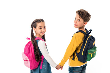 schoolchildren with backpacks holding hands and looking back isolated on white