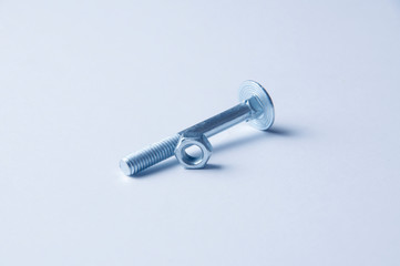 Metal bolt and nuts isolated on white background