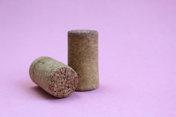 Wine cork two pieces on a pink background