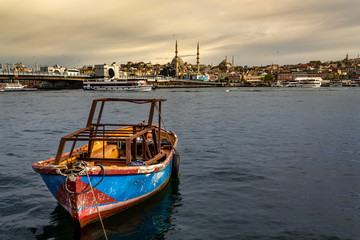 Istanbul landscape, small boat sea, mosque and Galata Bridge