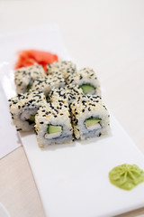 Sushi roll sushi with prawn, avocado, cream cheese, sesame. Sushi menu. Japanese food.