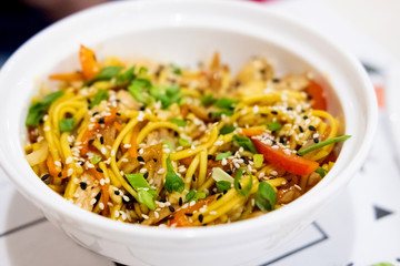 Udon noodles with meat and vegetables in an Asian style