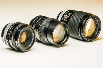 Three old photographic lenses