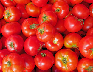 fresh tomatoes top view close up, natural red background
