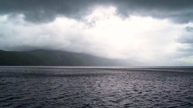 Dramatic image of agitated sea near mountain island, Croatia.