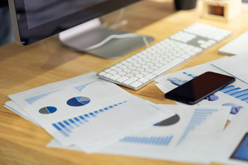 Business documents, financial statistics reports graphs and charts at the office