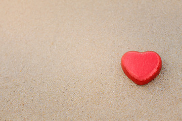 Chocolate color Lovely red heart on the beach. Background is a natural in real place, creative Valentine's Day Concept, tropical style background made in Phuket, Thailand.